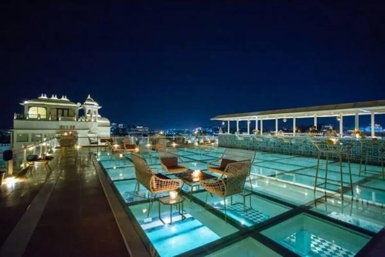 Modern interior and dining setup at Baro Masi Cafe in Udaipur